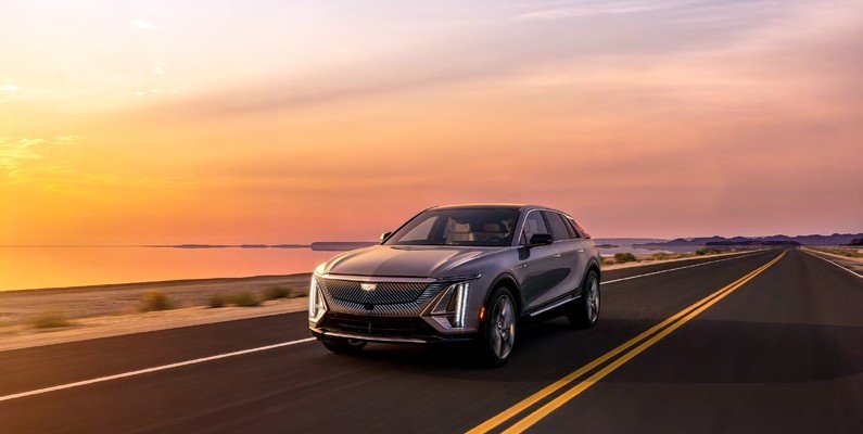 Cadillac Driving in the Sunset