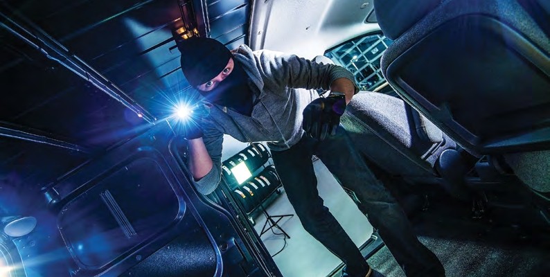 Masked Man Sneaking inside truck