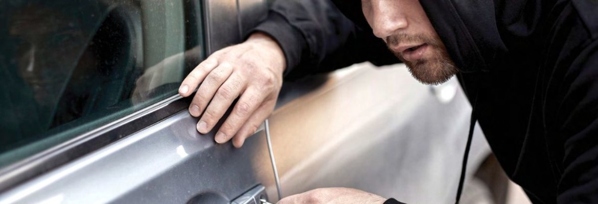 Man Breaking Into Car