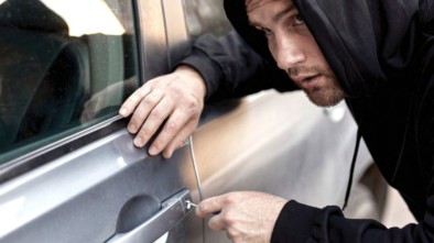 Man Breaking Into Car