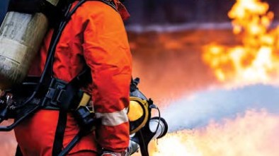 Firefighter spraying hose