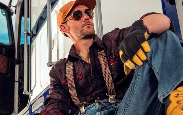 Man sitting beside truck